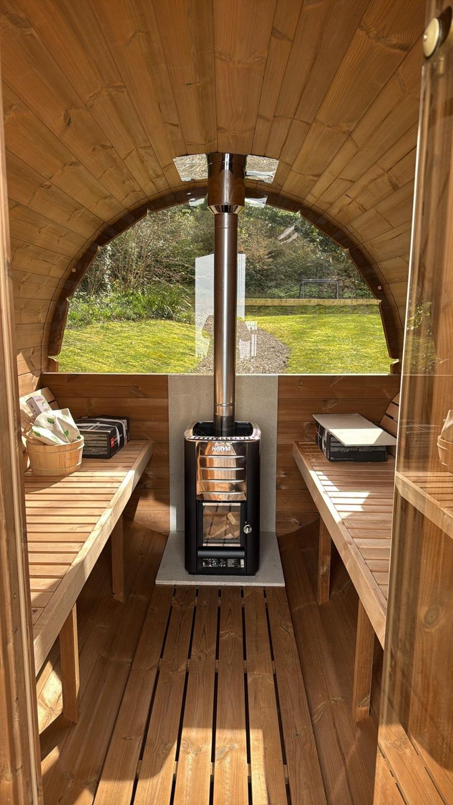 Sauna interior with benches and stove 11