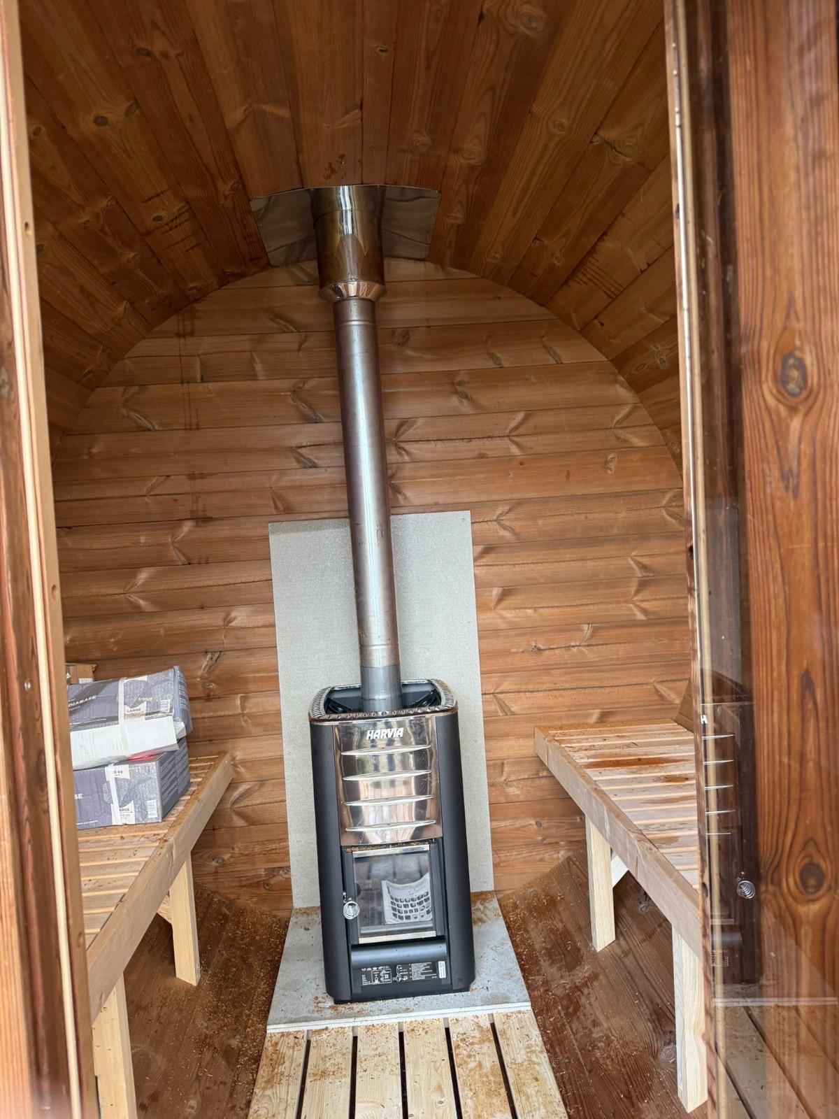 Sauna interior with benches and stove 12