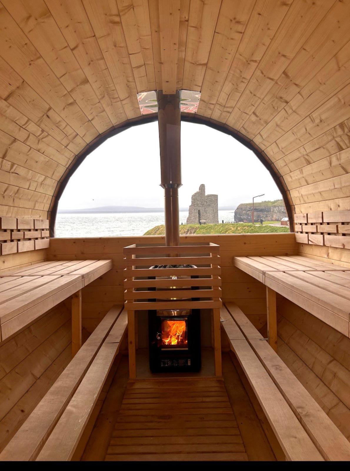 Sauna interior with benches and stove 13