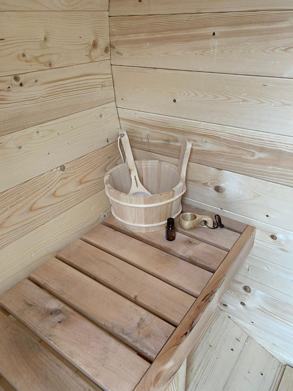 Sauna interior with benches and stove 14