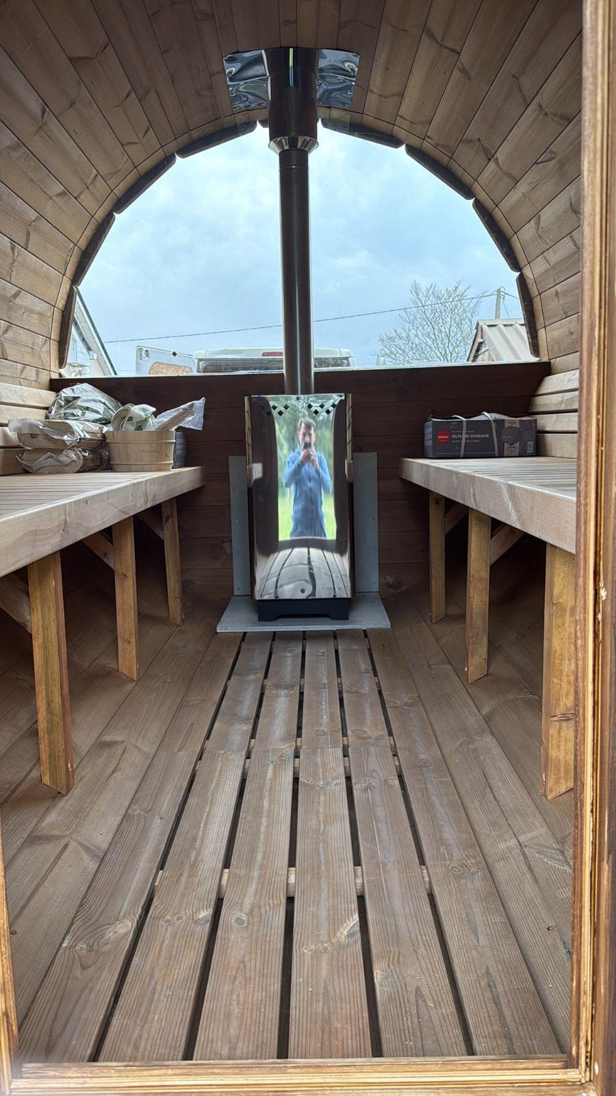 Sauna interior with benches and stove 15
