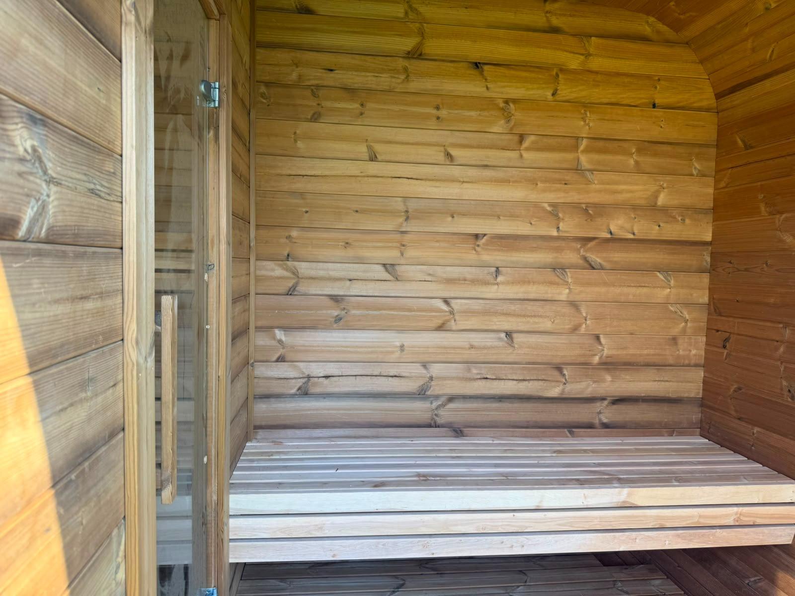 Sauna interior with benches and stove 18