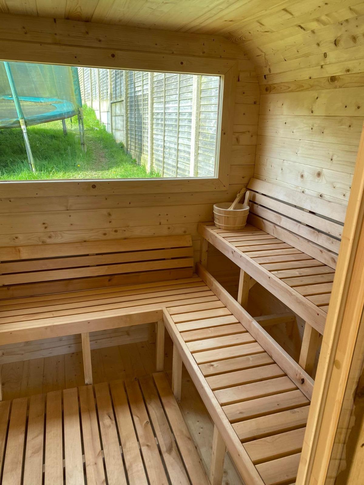 Sauna interior with benches and stove 2