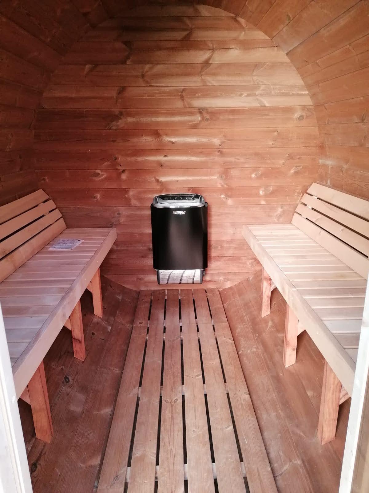 Sauna interior with benches and stove 6