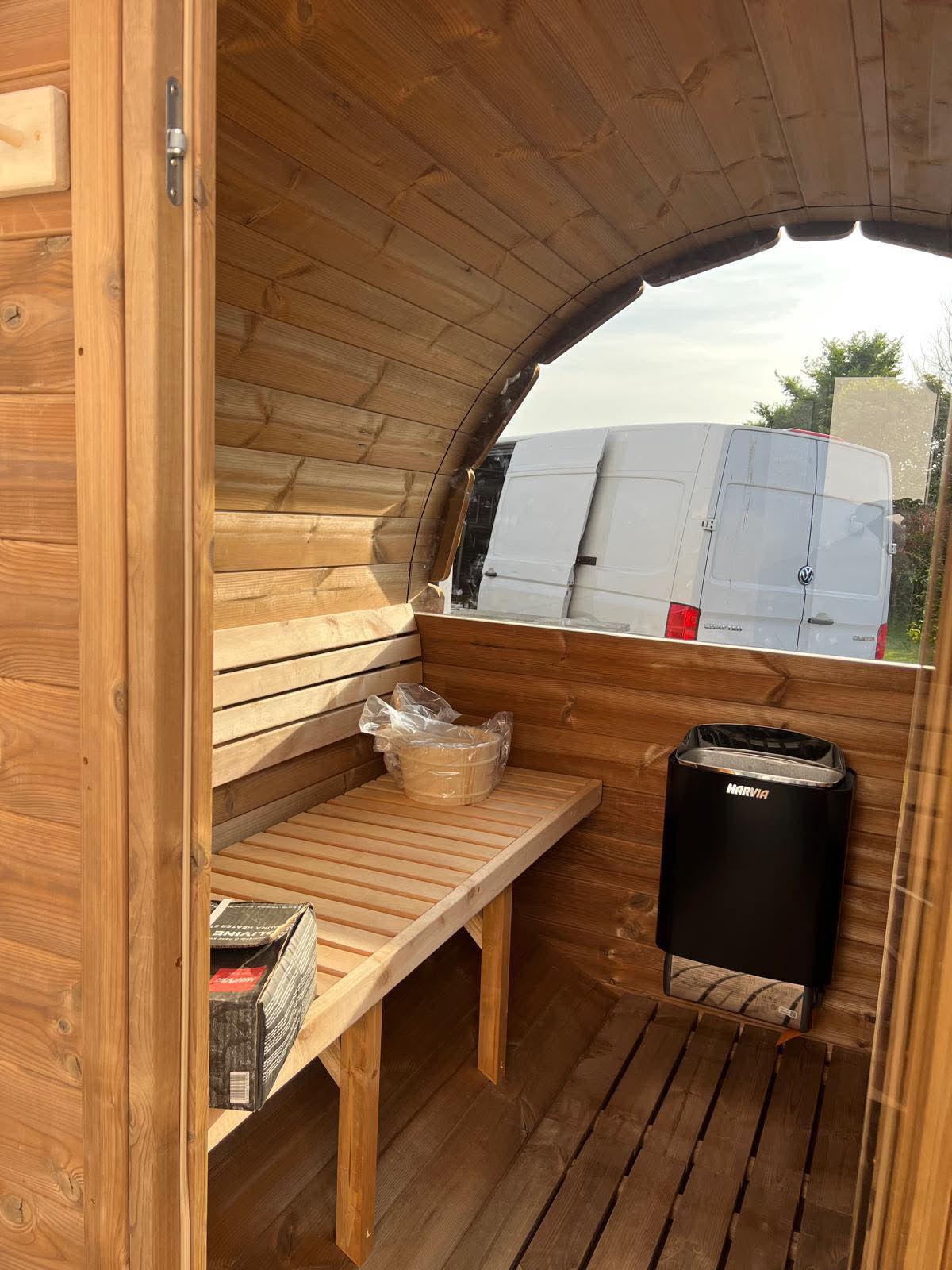 Sauna interior with benches and stove 7