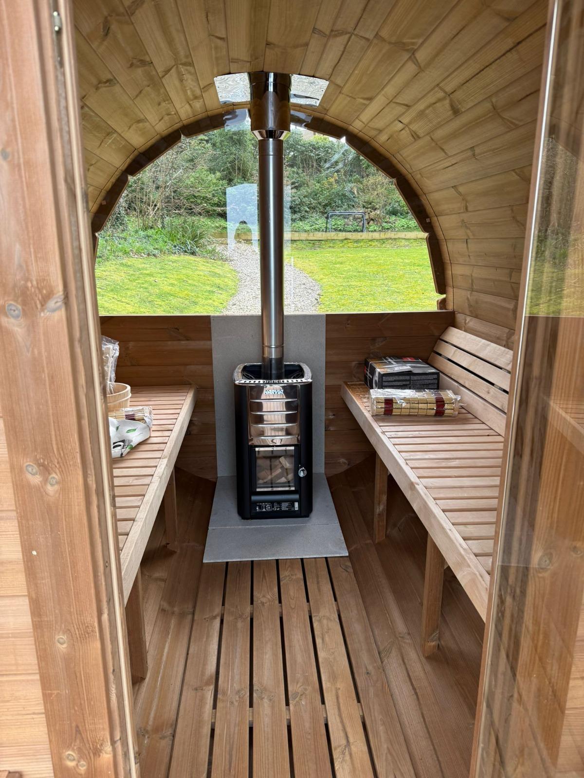 Sauna interior with benches and stove 9